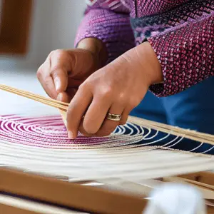 Visualize skilled hands gracefully weaving intricate patterns, forming a protective web that filters out negativity while allowing only positive dreams to pass through.